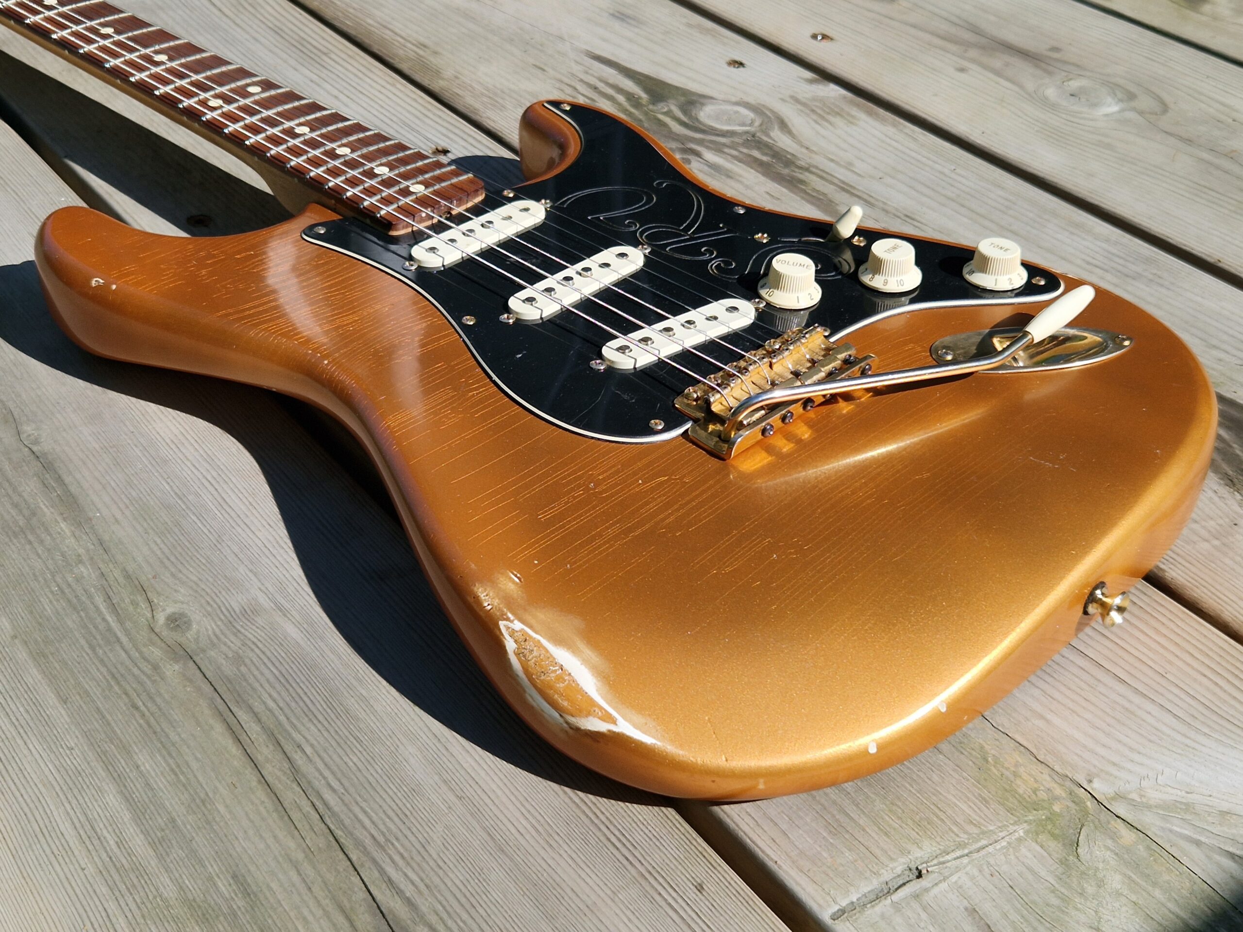 Firemist Gold nitro refinish, nitro checking, medium relic.